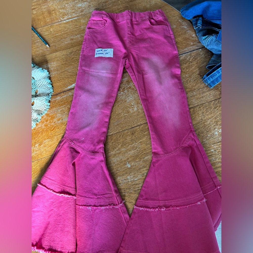Girl’s bell bottoms jeans.